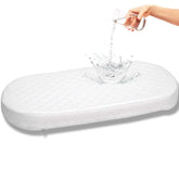 First Essentials bassinet mattress pad oval top view shows a safe sleeping surface