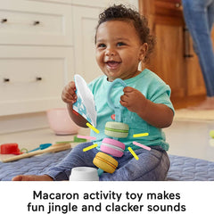 Fisher-Price Baby Bakery Treats macaron toy ribbons for engaging sensory exploration.