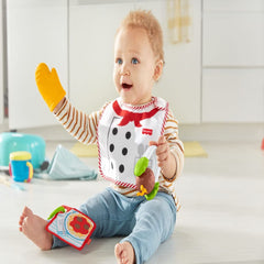 Fisher-Price Cutest Chef tongs with meatball spinner for interactive play.