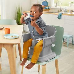 Fisher-Price SpaceSaver high chair navy foliage tray closeup—deep-dish tray reduces spills.