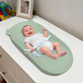 FLEUFAB baby changing pad top view showing compact dresser-ready design for easy setup