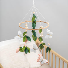 Flora & Ivy butterfly mobile boho nursery design complements eclectic spaces.