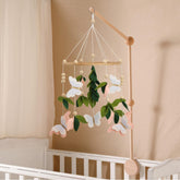 Flora & Ivy butterfly mobile pink butterflies with gold accents promote a soothing nursery atmosphere.