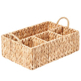 Floramill wicker basket divided storage with handles keeps diapers neatly organized on shelves.