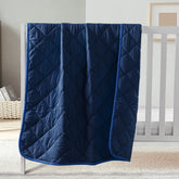 FLXXIE comforter 43x60 folded closeup highlights soft microfiber for all-season comfort.