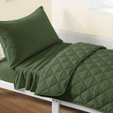 FLXXIE toddler olive quilt close-up showing soft microfiber stitching for durable comfort