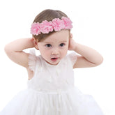Fmeida soft pink headband with flower crown on a baby girl, photography prop.