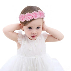 Fmeida soft pink headband with flower crown on a baby girl, photography prop.