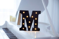Foaky marquee alphabet letters arranged on table for custom words