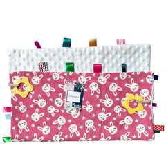 FOMAISELF White Rabbit tag blanket close-up, bright ribbons support visual interest and early color learning.