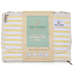 Four Cuddles portable diaper changing pad head-support cushions baby's head during changes.