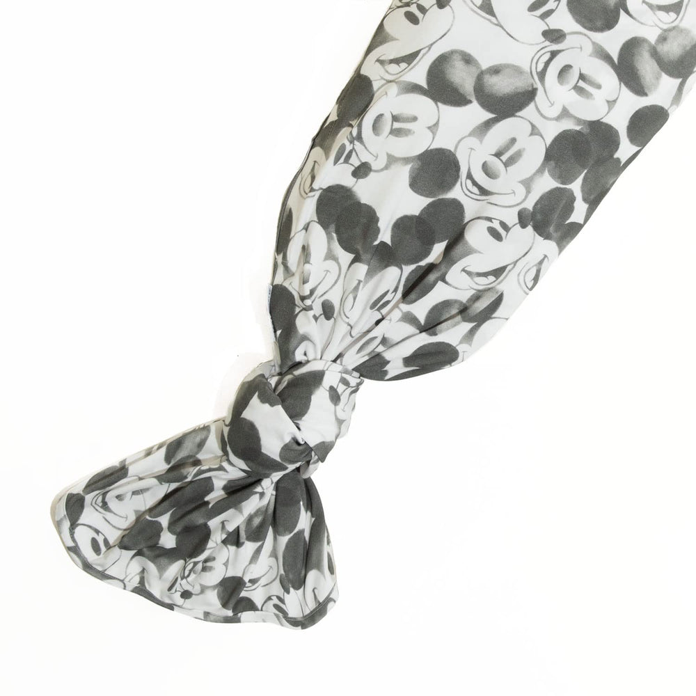 Freshly Picked swaddle with Mickey Mouse design promotes calm, cozy sleep.