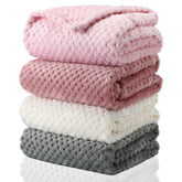 Frienda baby fuzzy blanket folded-compact for space-saving storage and travel warmth.