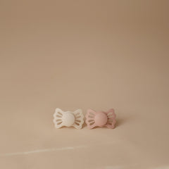 FRIGG Lucky symmetric mouth-fit improves alignment and nipple orientation