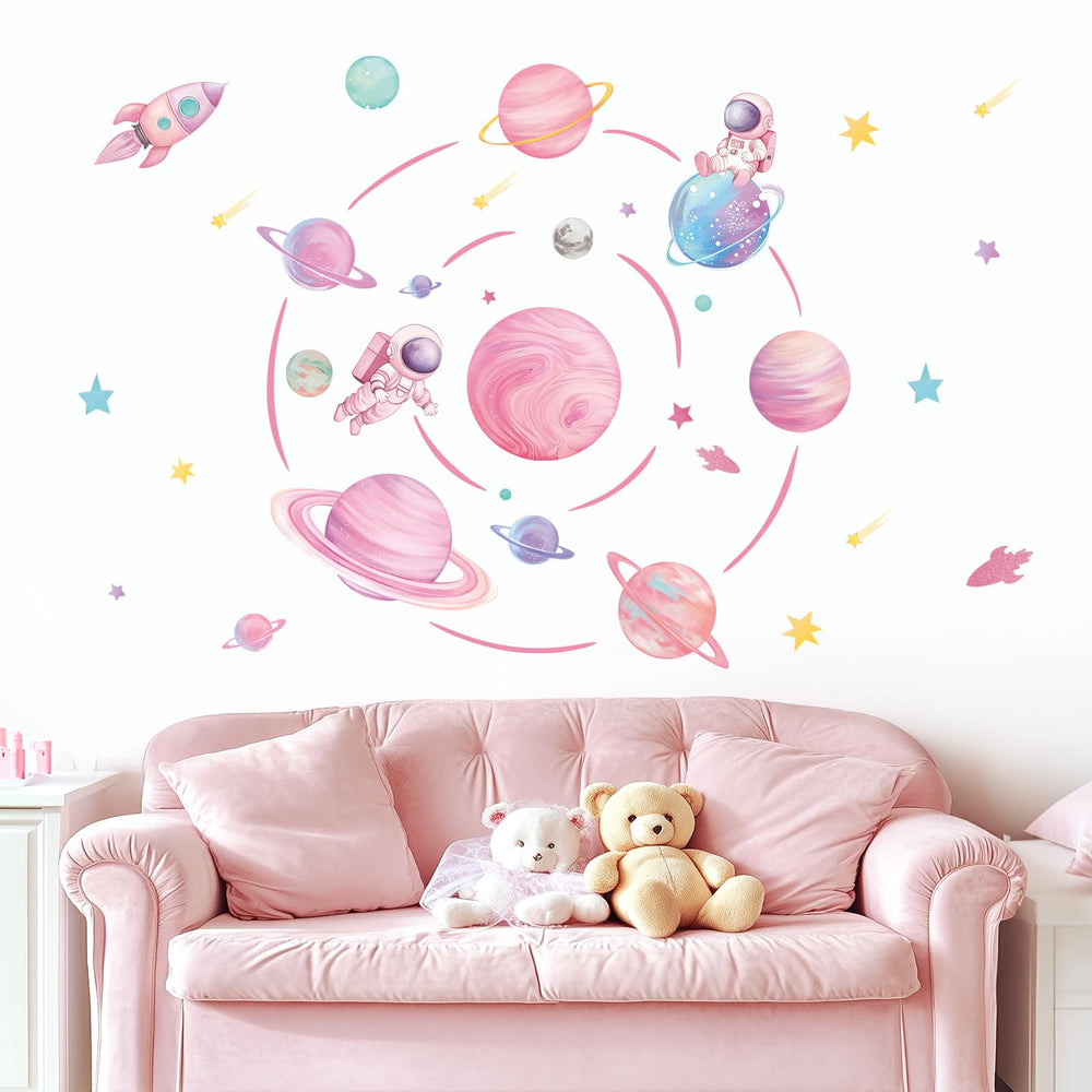 FUFUQUARE pastel pink planet orbits wall decal with rocket sparks imaginative play in kids room.