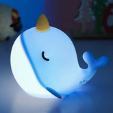 Fuloon Narwhal Night Light in blue tap-control mode for bedtime routines.