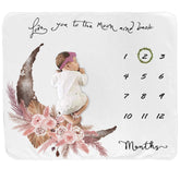 Fundich baby milestone blanket on baby girl for month-by-month photo keepsakes.
