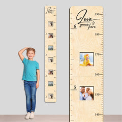 GADNIA growth chart with wall-mounted frames for milestone photos.