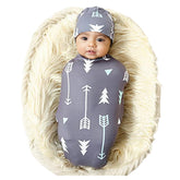 Galabloomer newborn swaddle blanket in gray arrow pattern offering gentle wrap option.