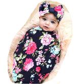 Galabloomer receiving blanket navy rose print showing soft knit fabric for delicate baby skin.