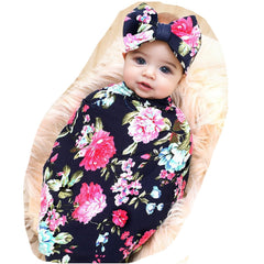Galabloomer receiving blanket navy rose print showing soft knit fabric for delicate baby skin.