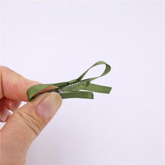 Gebelle multicolor bow clips arranged together for versatile playful styles.