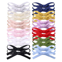 Gebelle small satin bow clip closeup with gentle hold for all hair types.