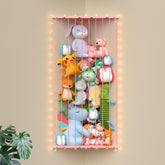 GGUO corner stuffed animal storage net on wall with LED lights for cozy display