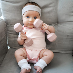 Giftty Baby Dumbbell Toy colorful rattle engages infants with sound and visual stimuli during play.
