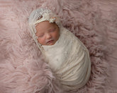 Giggle Angel newborn wrap pink soft fabric ready for gentle swaddling during photos
