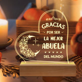 GiltGlimmer Abuela engraved acrylic night light glows warmly on a bedside table for sentimental moments.