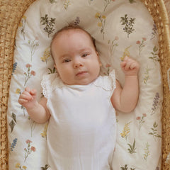 GLLQUEN BABY bassinet sheets ultra-soft fabric close-up on skin.