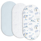 Gllquen Baby muslin bassinet sheets in light blue on bed for breathable comfort.