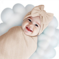 Golener bow headband—textured knit and gentle stretch for comfy wear.