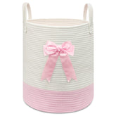 Goodheim pink-woven laundry hamper with bow adds charming nursery storage