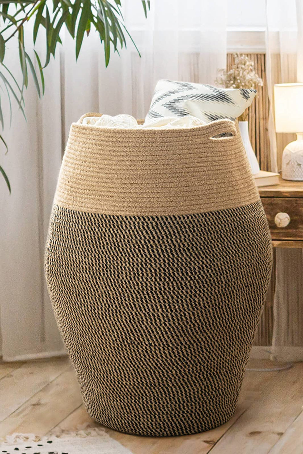 Goodpick 105L jute rope laundry hamper full view in a modern bedroom for organized laundry storage.