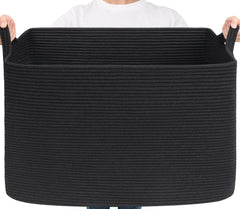 Goodpick Large Woven Storage Basket holding blankets for organized living room storage.