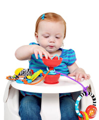 Grapple stroller-tray-attachment secures toys for travel and on-the-go meals.