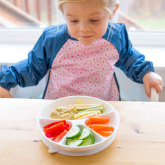 Green Sprouts Easy-Wear Long Sleeve Bib flipped-pocket catches crumbs with extended front.