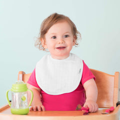 Green Sprouts Muslin Bibs bright striped design adds color to feeding time.