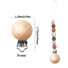Greneric beech wood pacifier clip attached to baby clothes for easy reach.