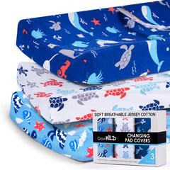 Grow Wild changing pad cover in ocean pattern sits on a nursery table offering a soft, breathable surface.