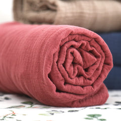 GRSSDER 100% cotton muslin crib sheet offers breathable, soft comfort for warm weather.
