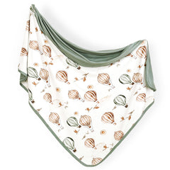 GRSSDER baby blanket balloon print closeup, soft jersey knit ideal for cozy swaddling