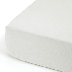 GRSSDER crib-sheet-in-use on standard mattress demonstrates snug deep-pocket fit