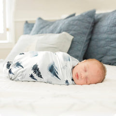 GRSSDER reversible deer-and-forest pattern enhances nursery style.
