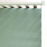 GRSSDER soft muslin crib sheet in Roman Green viewed full on bed for soft, breathable comfort