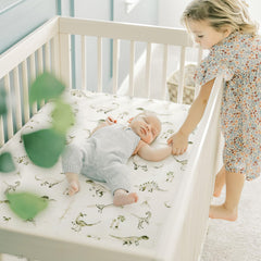 GRSSDER stretch crib sheet on mattress demonstrates easy on-off with elastic edges.