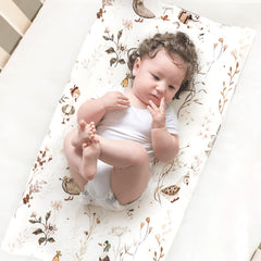 GRSSDER cover on changing pad demonstrates 4-way stretch for snug, unrestricted movement