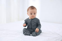 GUISBY 4-Pack baby sleepers knit fabric texture emphasizing softness and breathable wear.